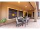 Covered patio with table and chairs, perfect for outdoor dining at 28694 N 127Th Ln, Peoria, AZ 85383