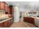 Open kitchen with granite countertops, custom cabinetry, and breakfast bar at 28694 N 127Th Ln, Peoria, AZ 85383