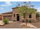 Beautiful home with stone accents and a landscaped yard at 28694 N 127Th Ln, Peoria, AZ 85383