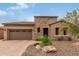 Single-story home with stone accents and desert landscaping at 28694 N 127Th Ln, Peoria, AZ 85383