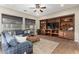 Spacious living room with a built-in entertainment center and comfortable seating at 28694 N 127Th Ln, Peoria, AZ 85383
