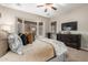 Bright main bedroom with a king bed and large windows at 28694 N 127Th Ln, Peoria, AZ 85383