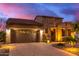 Single-story home with stone accents and desert landscaping at 28694 N 127Th Ln, Peoria, AZ 85383
