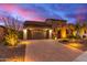 Single-story home with stone accents and desert landscaping at 28694 N 127Th Ln, Peoria, AZ 85383
