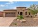 Single-story home with stone accents and desert landscaping at 28694 N 127Th Ln, Peoria, AZ 85383