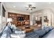 Bright and airy living room with hardwood floors and a sectional sofa at 28694 N 127Th Ln, Peoria, AZ 85383