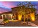 Single-story home with stone accents and desert landscaping at 28694 N 127Th Ln, Peoria, AZ 85383