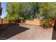 Spacious backyard with gravel and a block wall at 26058 W Yukon Dr, Buckeye, AZ 85396