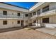 Exterior view of an apartment building with stairs and gravel at 18202 Cave Creek Rd # 141, Phoenix, AZ 85032