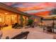 Evening view of a relaxing backyard with a pool and patio, ideal for outdoor living at 33231 N 72Nd Pl, Scottsdale, AZ 85266