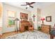 Home office with wooden desk and ceiling fan at 33231 N 72Nd Pl, Scottsdale, AZ 85266