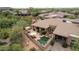 Aerial view showcasing home, pool, and surrounding desert landscape at 33231 N 72Nd Pl, Scottsdale, AZ 85266