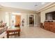 Living room with wooden coffee table and entryway view at 33231 N 72Nd Pl, Scottsdale, AZ 85266