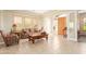 Living room with comfortable seating, wooden coffee table, and tile floors at 33231 N 72Nd Pl, Scottsdale, AZ 85266