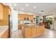 Modern kitchen with light wood cabinets, granite countertops, and stainless steel appliances at 33231 N 72Nd Pl, Scottsdale, AZ 85266