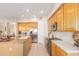 Modern kitchen with stainless steel appliances and light wood cabinetry at 33231 N 72Nd Pl, Scottsdale, AZ 85266