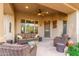 Relaxing covered patio with comfortable seating and a ceiling fan at 33231 N 72Nd Pl, Scottsdale, AZ 85266