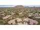 Aerial view of a luxury community nestled against a mountain backdrop at 33231 N 72Nd Pl, Scottsdale, AZ 85266