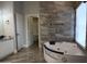 Main bath with corner soaking tub and walk-in shower at 27824 N 256Th Ave, Wittmann, AZ 85361