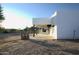 White stucco home with covered patio and desert landscaping at 27824 N 256Th Ave, Wittmann, AZ 85361