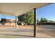 Covered patio with string lights and backyard access at 27824 N 256Th Ave, Wittmann, AZ 85361
