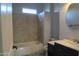 Bathroom with bathtub, shower, and updated vanity at 27824 N 256Th Ave, Wittmann, AZ 85361