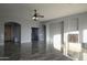 Spacious living room with tile floors and fireplace at 27824 N 256Th Ave, Wittmann, AZ 85361