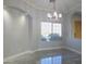 Bright dining room with large window and tile flooring at 27824 N 256Th Ave, Wittmann, AZ 85361