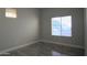 Bright bedroom with tile flooring and window views at 27824 N 256Th Ave, Wittmann, AZ 85361