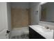 Clean bathroom with bathtub, shower, and vanity at 27824 N 256Th Ave, Wittmann, AZ 85361