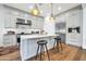 Bright kitchen features white shaker cabinets and a large island at 7240 N 13Th Ln, Phoenix, AZ 85021