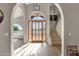 Bright and spacious entryway with high ceilings, wood floors and large front door at 15728 E Burro Dr, Fountain Hills, AZ 85268