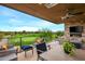 Relaxing patio with golf course view, fireplace, and comfortable seating at 37200 N Cave Creek Rd # 1082, Scottsdale, AZ 85262