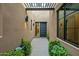 Private courtyard entry with modern design and landscaping at 37200 N Cave Creek Rd # 1082, Scottsdale, AZ 85262