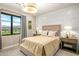 Bright bedroom with mountain views, neutral tones, and modern nightstands at 37200 N Cave Creek Rd # 1082, Scottsdale, AZ 85262