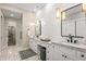 Modern bathroom with double vanity and patterned tile floor at 37200 N Cave Creek Rd # 1082, Scottsdale, AZ 85262