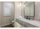 Elegant powder room with marble vanity and designer wallpaper at 37200 N Cave Creek Rd # 1082, Scottsdale, AZ 85262