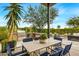 Outdoor kitchen with grill and dining area at 37200 N Cave Creek Rd # 1082, Scottsdale, AZ 85262
