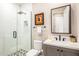 Clean bathroom with white subway tile, gray vanity, and frameless shower at 37200 N Cave Creek Rd # 1082, Scottsdale, AZ 85262