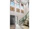 Bright and spacious entryway with modern staircase and art at 37200 N Cave Creek Rd # 1082, Scottsdale, AZ 85262