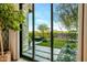 Landscaped backyard with artificial turf and desert plants at 37200 N Cave Creek Rd # 1082, Scottsdale, AZ 85262