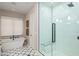 Spa-like bathroom with soaking tub, glass shower, and patterned tile floor at 37200 N Cave Creek Rd # 1082, Scottsdale, AZ 85262