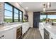 Modern wet bar with wine cooler and stunning golf course view at 37200 N Cave Creek Rd # 1082, Scottsdale, AZ 85262