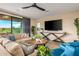 Relaxing living room with comfortable seating and large TV at 37200 N Cave Creek Rd # 1082, Scottsdale, AZ 85262
