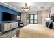 Serene bedroom with blue accent wall, large window, and sitting area at 37200 N Cave Creek Rd # 1082, Scottsdale, AZ 85262