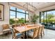Elegant dining room with a live-edge wood table and access to a patio at 37200 N Cave Creek Rd # 1082, Scottsdale, AZ 85262