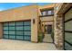 Modern home exterior with a stylish garage and gated entryway at 37200 N Cave Creek Rd # 1082, Scottsdale, AZ 85262