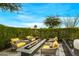 Fire pit with seating area and lush landscaping at 37200 N Cave Creek Rd # 1082, Scottsdale, AZ 85262