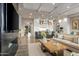 Open concept living space showcasing a kitchen and living area with a modern fireplace at 37200 N Cave Creek Rd # 1082, Scottsdale, AZ 85262