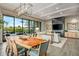 Open dining area with a large wood table and view into living room at 37200 N Cave Creek Rd # 1082, Scottsdale, AZ 85262